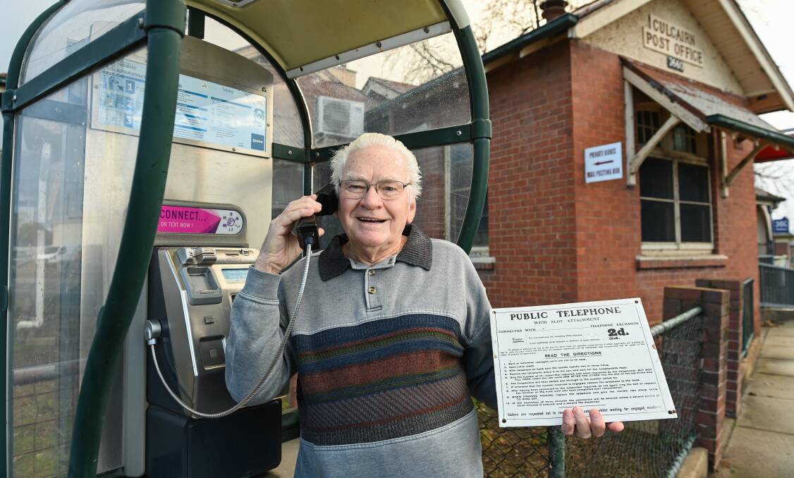 CALL BACK: Former manger of the Culcairn phone exchange, Harold Piltz with a plaque that used to be on old payphones at the last remaining phone in town. Picture: MARK JESSER