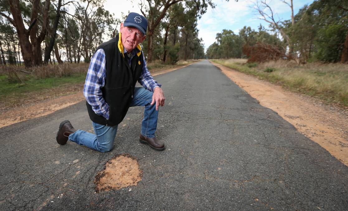 BAD CALL: Federation councillor Fred Longmire says the Balldale Road is in urgent need of repairs and has concerns regarding recently allocated government funding. Picture: JAMES WILTSHIRE