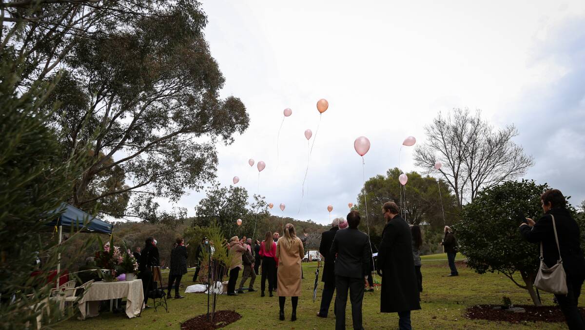 GOODBYE: Family and friends said a solemn goodbye to Julia Nation by releasing pink balloons into the sky. Picture: JAMES WILTSHIRE