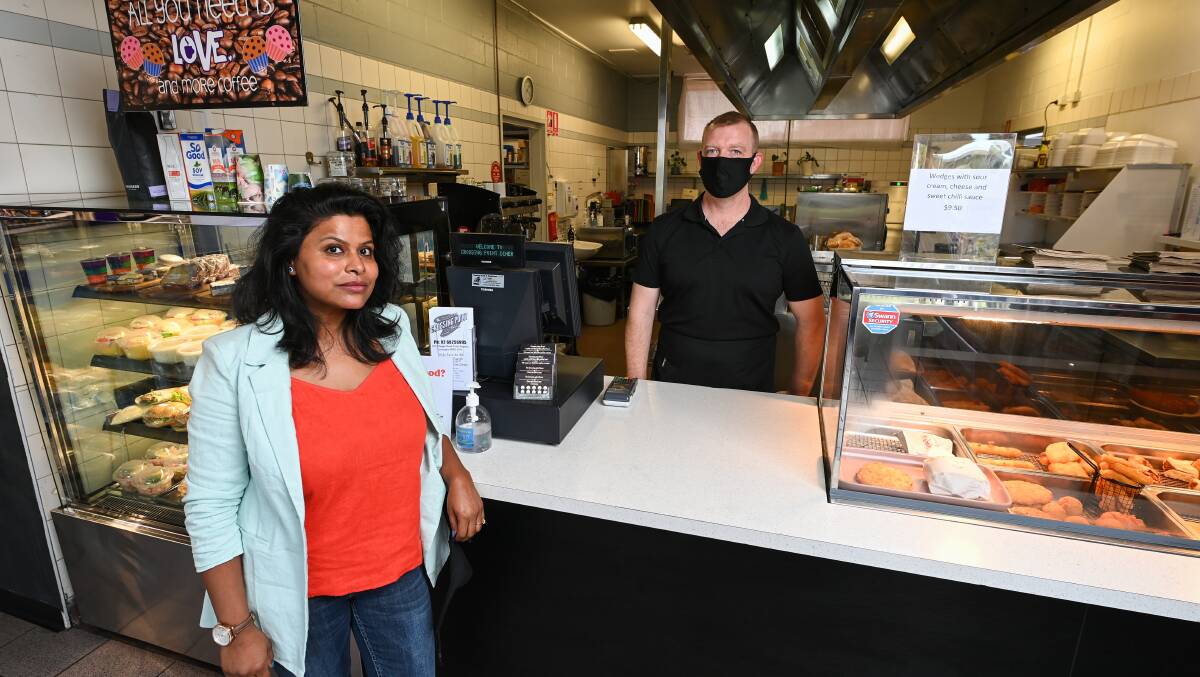 KEEP TRUCKING: Crossing Point Diner owner Smita Behera and manager Jamie Brennan say it's unfair that truck drivers are not able eat indoors. Picture: MARK JESSER