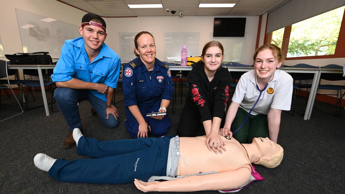 HANDS-ON: NSW Ambulance Service paramedic Michelle Owens with students Mitch Horner-Bergsma, 17, Aalirah Kirkby, 17 and Mara O'Keeffe, 17. Picture: MARK JESSER