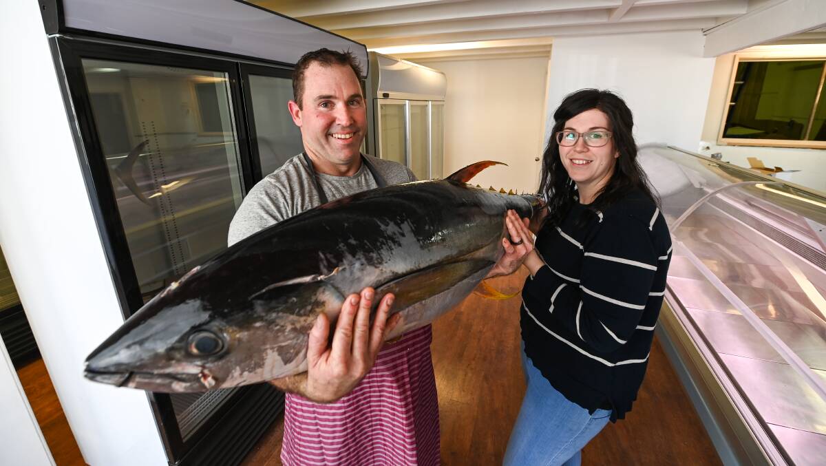 BIG CATCH: Jeffrey and Morgan Barton with a 35kg yellowfin tuna. The pair will open Wodonga's Seafood and Game Store on High Street on Saturday and plan to source quality, local produce. Picture: MARK JESSER