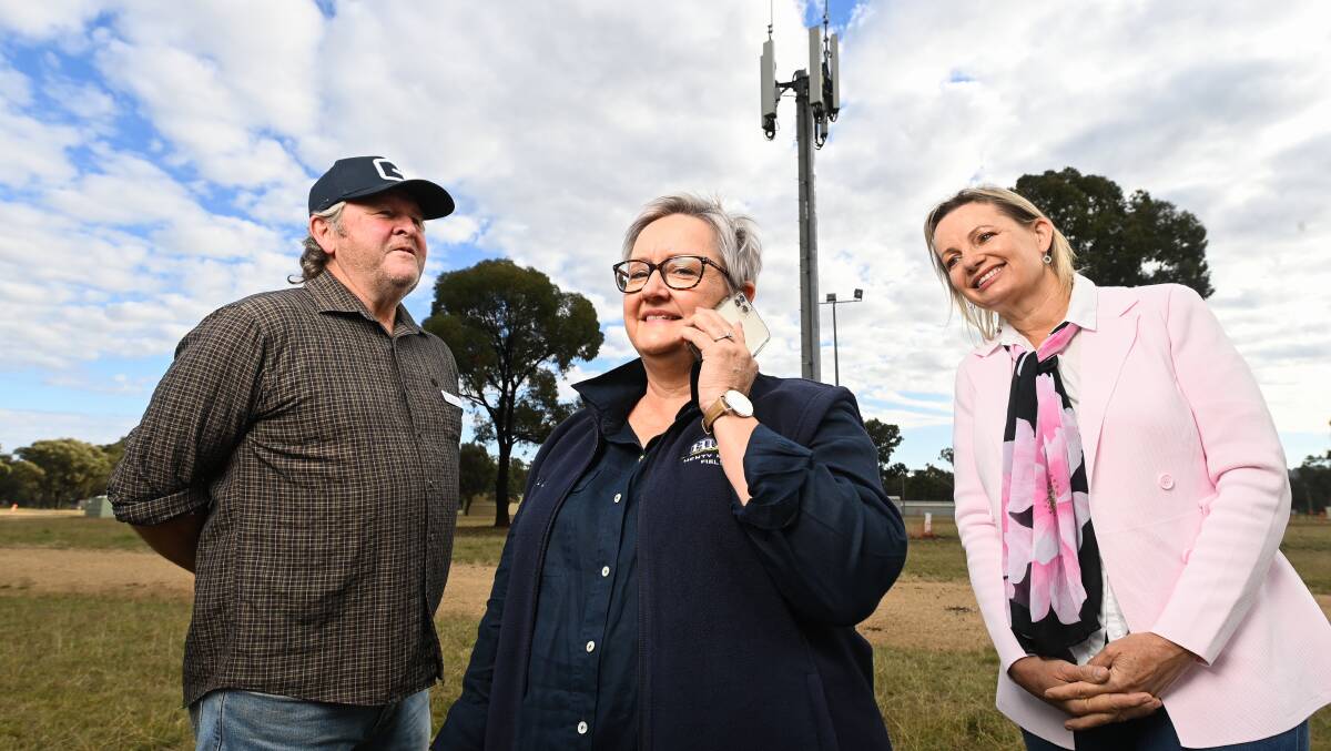 BUZZING: Greater Hume Councillor Ian Forrest, Henty Machinery Field Day chief executive Belinda Anderson and Member for Farrer Sussan Ley in front of the new phone tower. Picture: MARK JESSER