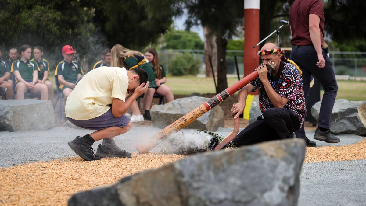 Wiradjuri man Darren Wighton leads the smoking ceremony for the official opening of Billabong High School's yarning circle. Picture by James Wiltshire