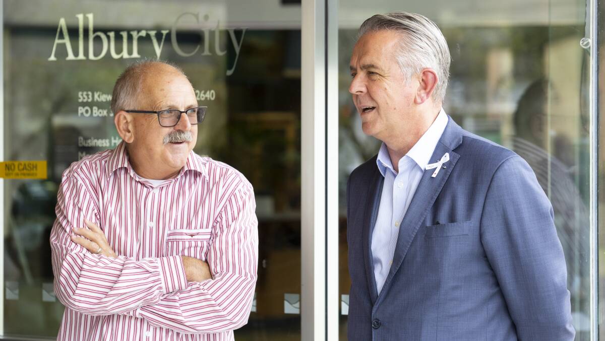 WORKING TOGETHER: Greater Hume's Steve Pinnick with AlburyCity's Frank Zaknich; the pair have collaborated to continue the Family Day Care services in Albury. Picture: ASH SMITH