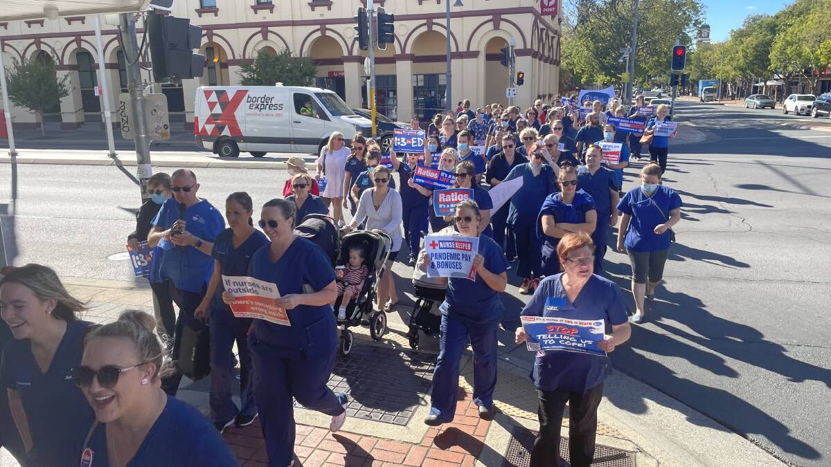 STRIKING: The nurses marched from Albury's QEII Square to Justin Clancy's office to demand action.