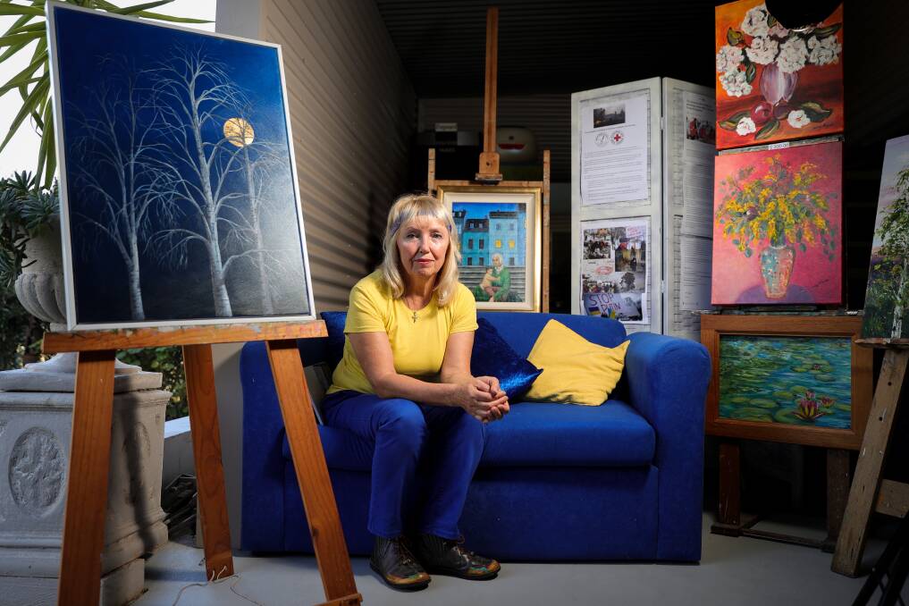 ART FOR UKRAINE: Albury artisit Stephanie Jakovac wears blue and yellow, the colours of the Ukrainian flag, in her studio. Ms Jakovac is hosting an Easter open studio fundraiser for the Ukrainian crisis. Picture: JAMES WILTSHIRE
