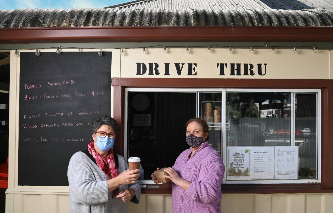COFFEE AND CHAT: Walla's Virginia Scholz with The Old Walla Bake Haus owner Lorna Williams. Picture: MARK JESSER