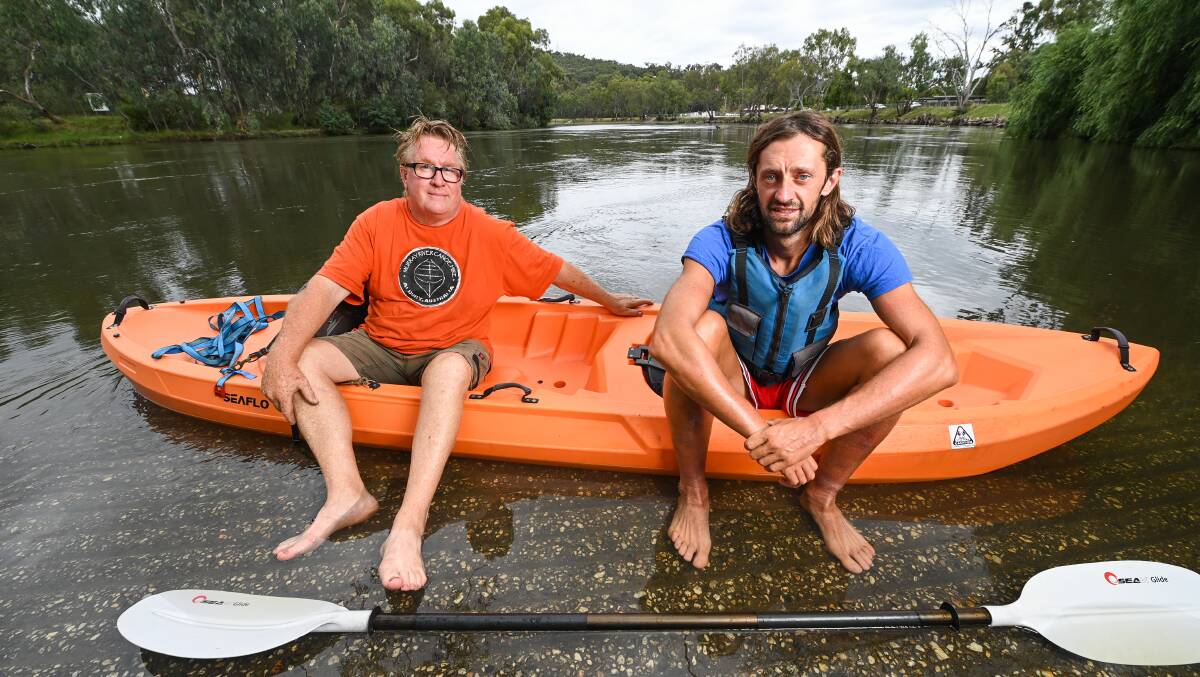 JOURNEY AHEAD: Murray River Canoe Hire's David Breedon with Italian traveler Simone Curati. Mr Curati says he will take his time paddling his kayak the all the way to the mouth of the Murray River and try to meet and connect with new people. Pictures: MARK JESSER