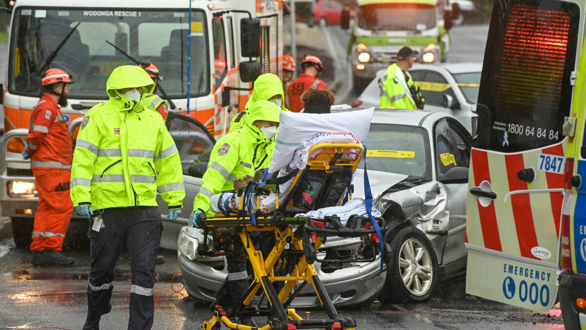 THE SCENE: Emergency services rushed to the crash on the corner of Brockley Street at Melrose Drive in Wodonga on Saturday morning. Pictures: MARK JESSER