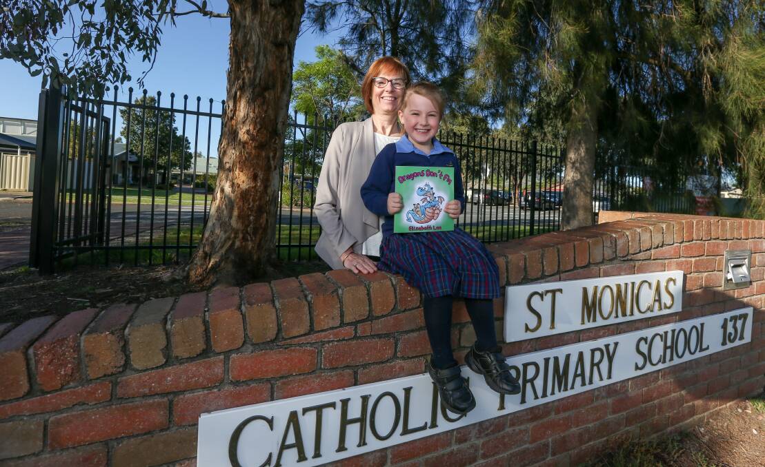 LOVE OF LEARNING: Five-year-old foundation student and author Elizabeth Lee with her teacher Mrs Lyn Bethune. Pictures: TARA TREWHELLA