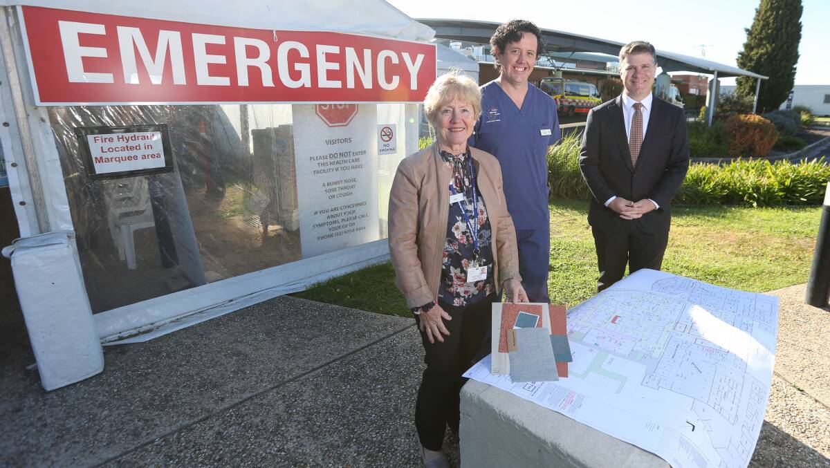 EXTRA SPACE: Albury Wodonga Health Deputy CEO Janet Chapman, ED Nurse Unit Manager Lindsay Nichols and Federal Member for Albury Justin Clancy with development plans and colour samples. Picture: TARA TREWHELLA.