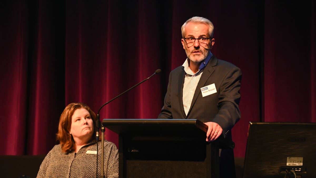 KEY SPEAKER: Solar Victoria chief executive Stan Krpan addresses the audience at the PowerHouse energy conference in Wodonga, while Renewable Albury Wodonga founder Bobbi McKibbon listens on. Picture: MARK JESSER 