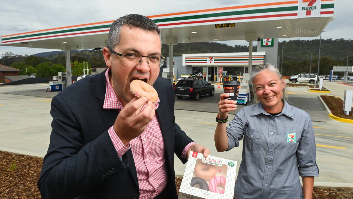 SWEET TREAT: Wodonga mayor Kevin Poulton with Wodonga's 7-Eleven store manager Nikki Stopps at the official opening on Thursday morning. Picture: MARK JESSER