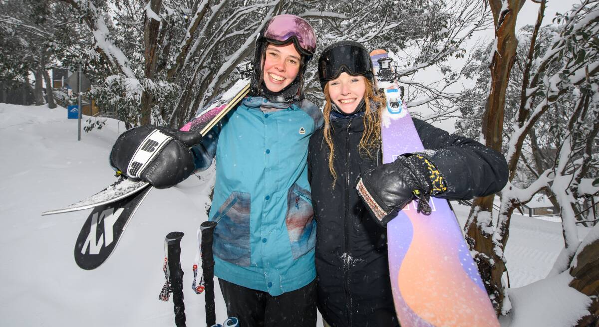 Bright's Teagan Atherstone and Mount Beauty's Lara May are enjoying squeezing in some skiing between working split shifts at Falls Creek. Pictures: MARK JESSER
