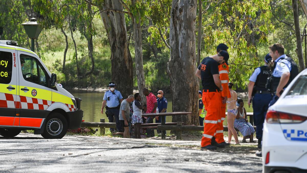SAD SCENE: Emergency services have searched the Murray River near Albury after a teen swimmer went missing in the water. Pictures: MARK JESSER
