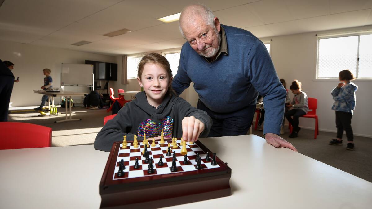 CHECK MATE: Jessica Browne, 8, playing chess with her grandfather Rick Oswald-Sealy at Albury PCYC. Pictures: JAMES WILTSHIRE