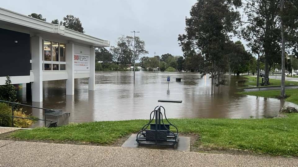 Floodwaters surrounding the Benalla Library. Later that day the water rose right up to the window in this photo. Picture by Mattie Hooker.
