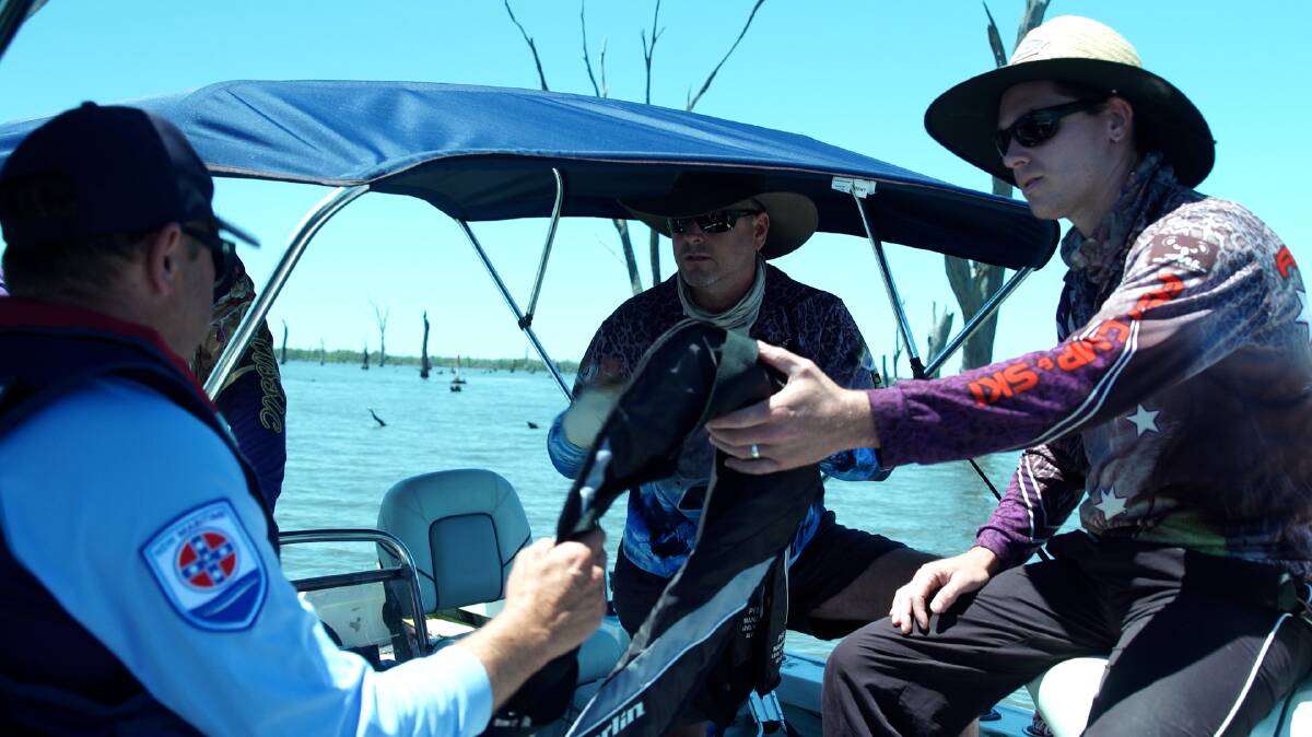 PATROL ON WATER: Senior boating safety officer Tim Peverell spent last weekend checking water users were compliant with life jacket rules on Lake Mulwala and in the Murray River. Pictures: CLINT POULTER