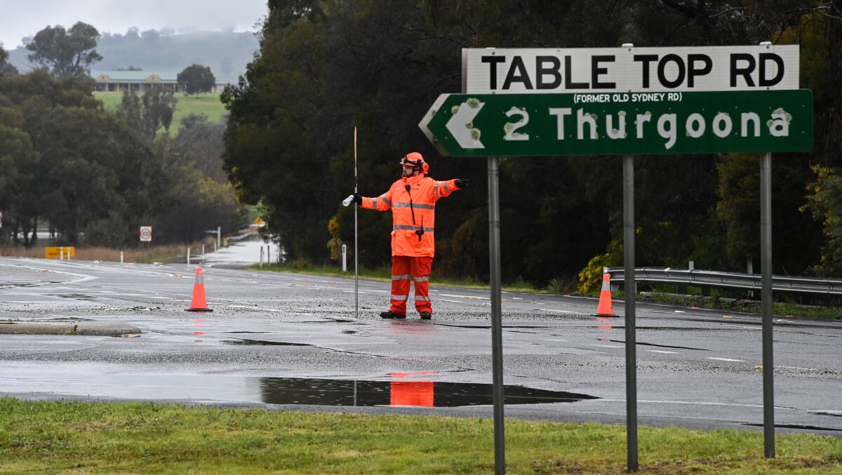 ROAD CLOSED: The Riverina Highway near Thurgoona between Kerr Road and Table Top Road was closed due to flooding on Saturday. Picture: MARK JESSER