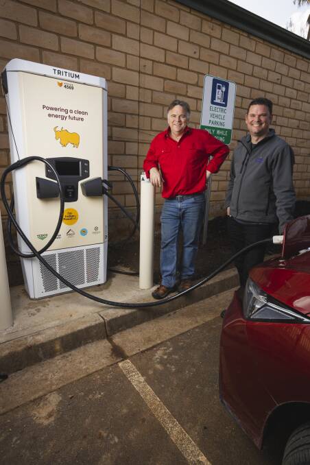Totally Renewable Yackandandah chair Matthew Charles-Jones and Indigo Power's Heath Shakespeare at Yackandandah's first electric vehicle charging station in August 2022. Picture by Ash Smith