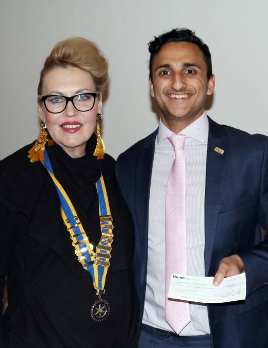 SCHOLARSHIP WINNER: Bhutanese refugee and University of Wollongong medical student Narayan Khanal with outgoing Albury-Hume Rotary Club president Margaret McDonald.