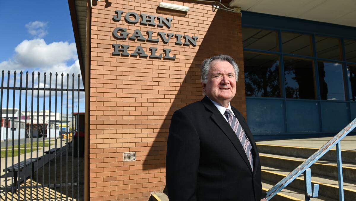 BIG GRINS: Wodonga Senior Secondary College executive principal Vern Hilditch says he's delighted to award the tender for the Galvin Hall and dual stadium. Picture: MARK JESSER