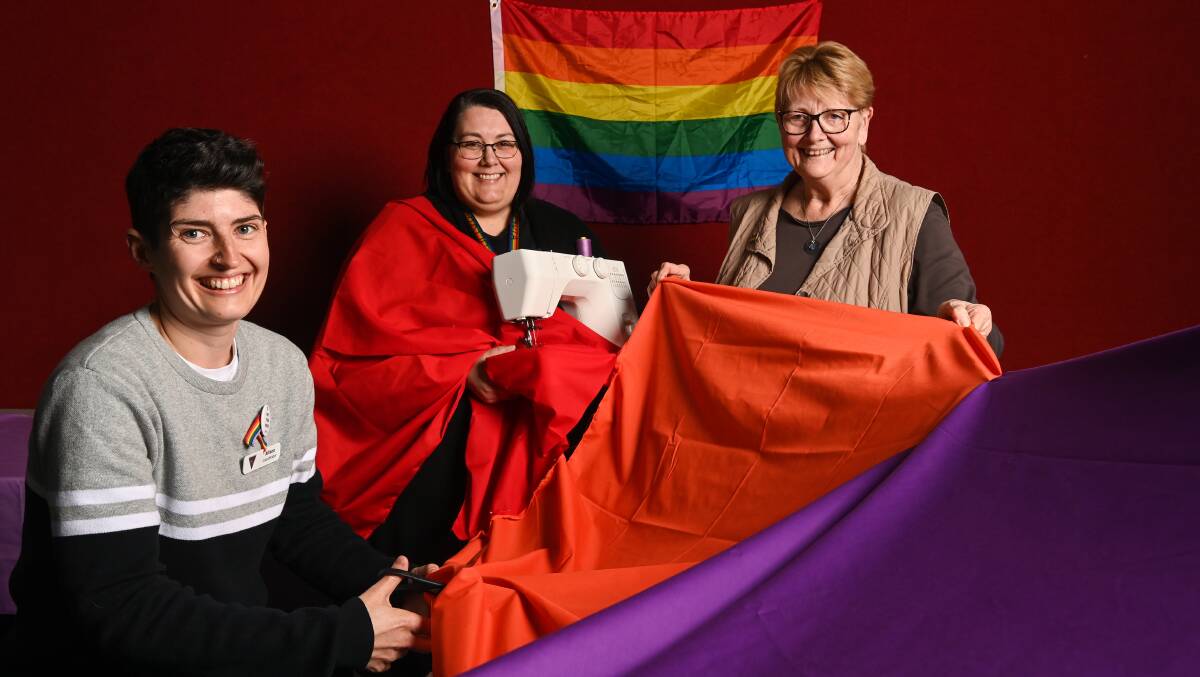 SEWING PRIDE: LINE president Allison Winters, secretary Olivia Sewell and Christine Sewell will help run a rainbow flag making project around north east towns to support the LGBTQIA+ community. Pictures: MARK JESSER