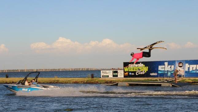 FLYING HIGH: Keenan Bulk Derry float upside down off the water ski jump in Lake Mulwala. Picture: SUPPLIED