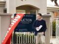 NO BIDS: Lachlan Hutchins of Stean Nicholls received no bids at the auction of 737 Jones Street on the weekend. Picture: ASH SMITH