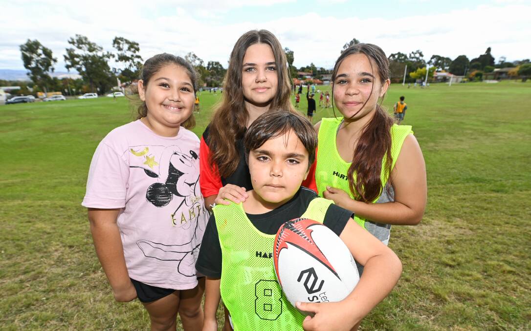 FUN AND FRIENDS: Albury residents Corey Murray, 8 with Sunday Kennedy, 9, Shakarla Kilby, 12, and Kirah Whitling, 12 at the Gindaymanha Sports Carnival on Bonnie Doon Oval. Picture: MARK JESSER