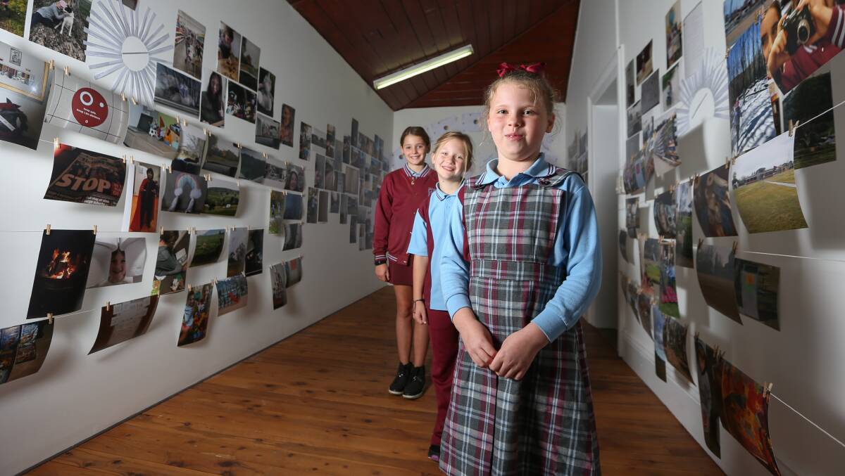 STUDENTS WORKS: Wodonga Primary School students Chloe Pierce, year 4, Mia Williams, year 2 and Lexie Simpson, year 1, have all submitted images for a special section of the exhibition by school students. Picture: TARA TREWHELLA.