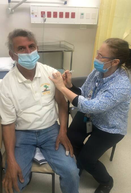 Moira Shire Council Mayor Libro Mustica getting his COVID-19 vaccination.