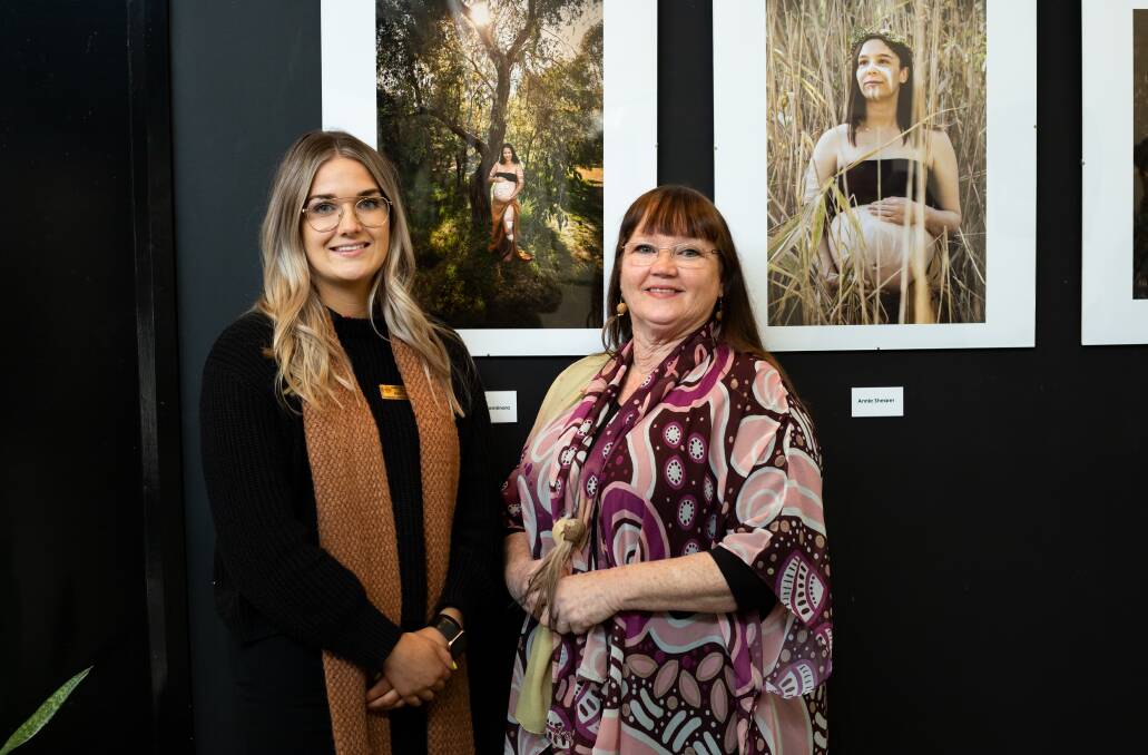 ETERNALISED: Proud Ngarrinjeri woman Brittany Wright and Gamilaroi woman Trish Cerminara in front of one of Ms Cerminara's photos at the exhibition in Wodonga TAFE's Eddie Kneebone gallery. Picture: TANIA MARTINI