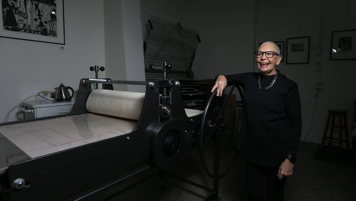 PRINT MAKING: Aunty Glennys Briggs with her "baby" a large print press, which she had delivered from to the border from Queensland. Picture: TARA TREWHELLA