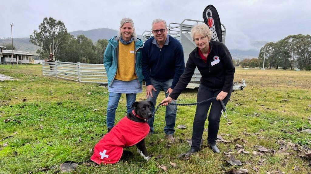 MAKING PROGRESS: Gateway Health bushfire recovery case manager Marije Vanepenhuijsen, Towong Shire mayor Andrew Whitehead and Red Cross bushfire recovery officer Jessica Davison with her dog, Ruby.