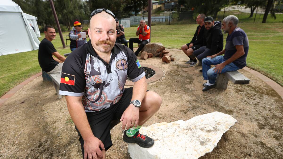 AROUND THE FIRE: Men's health nurse Matthew Warry at the Albury Wodonga Aboriginal Health Services 'pit stop' men's drop in health check event, designed to engage Indigenous men with their health. Picture: JAMES WILTSHIRE.