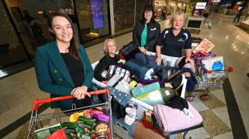 GIVING GENEROUSLY: West End Plaza centre manager Nicole Singh with Carevan's Leanne Johnson, director Jacqui Partington and State Protective Services regional manager Cheryl McIntyre. Picture: MARK JESSER