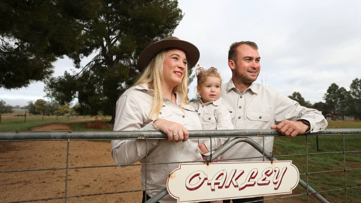 Sarah, Jack and Charlotte (2) Stow on their property 'Oakley farm', near Burrumbuttock. Pictures: JAMES WILTSHIRE
