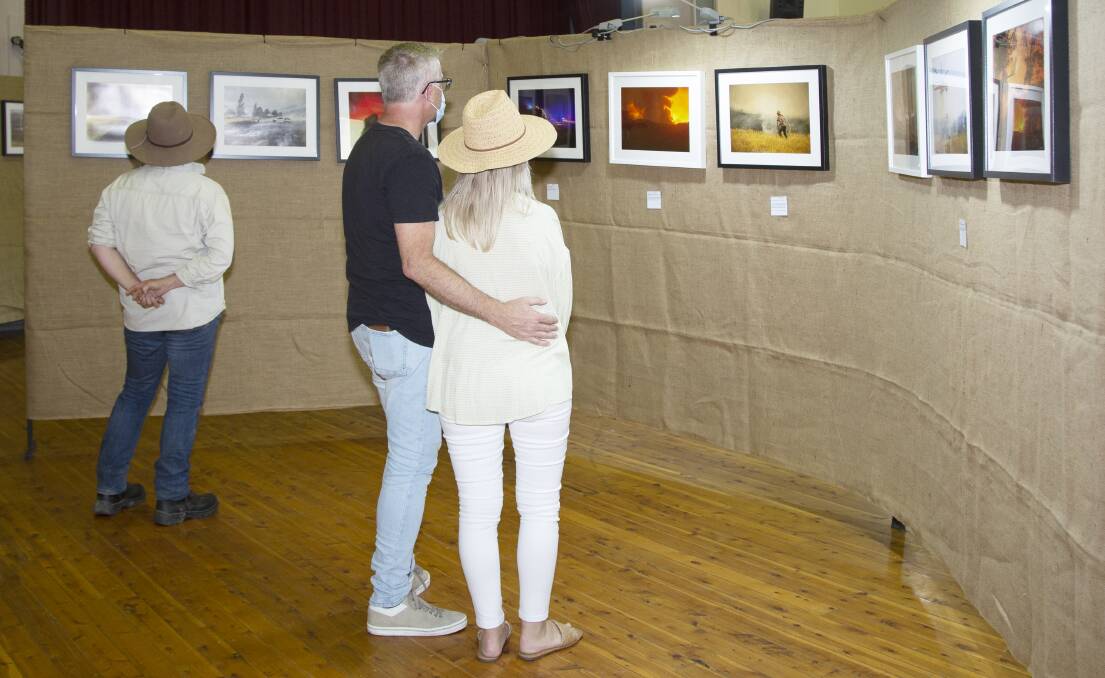 STIRRING EMOTION: The bushfire recovery photo exhibition brought up a lot of emotion for viewers. Picture: MICHAEL EGAN