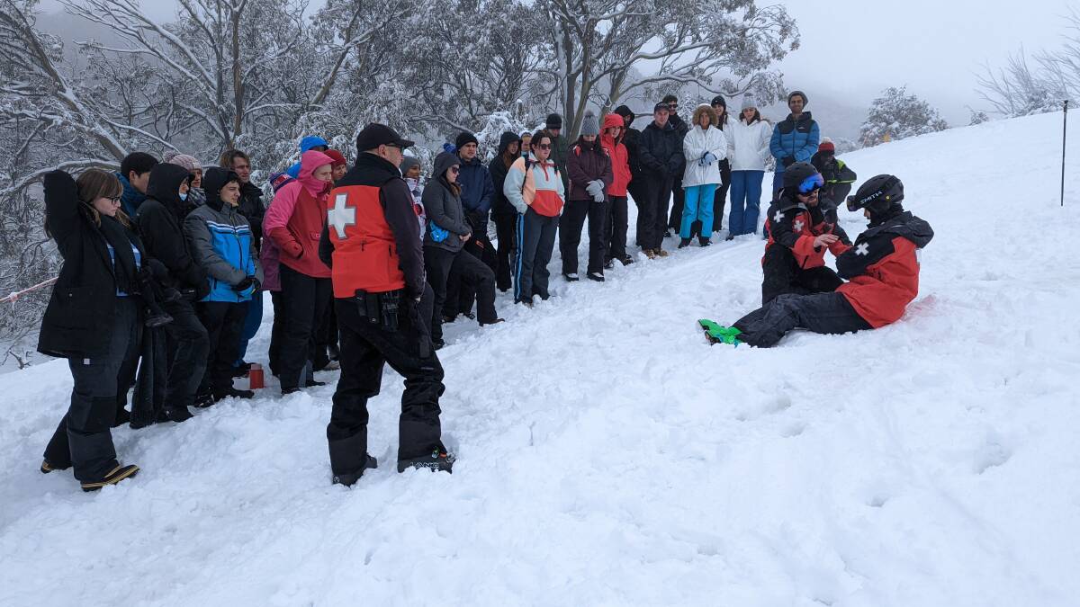 AT WORK ON THE SLOPES: The Alpine medicine showcase saw the Falls Creek Ski Patrol demonstrate a patients journey from injury to emergency treatment. Picture: SUPPLIED
