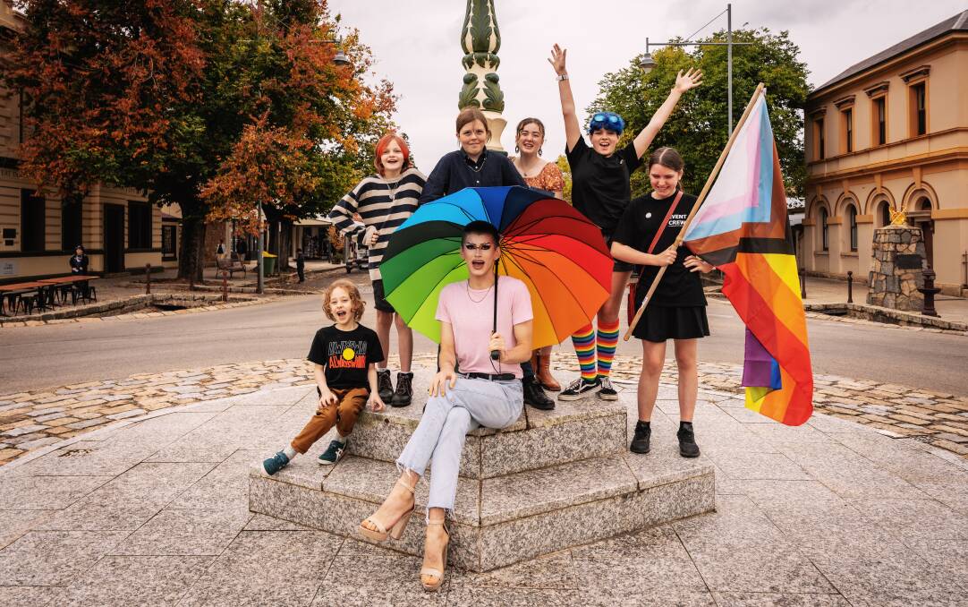 COLOURFUL KIDS: Sean McMahon (centre) with Charles Wallen, Amii Rennick, Leon Truex, Riley Reid, Thea Fraser and Aoife Lewis pose for a picture in Beecworth's main street. Picture: TOURISM NORTH EAST
