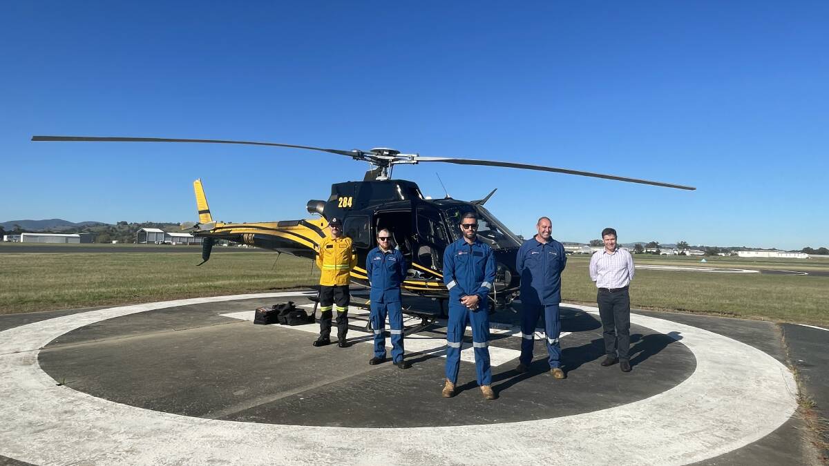 TEAM EFFORT: NSW RFS southern border team member Andrew Davis, Crown Lands air observer Scott Vale, mission commander Shaun Flood, air observer Bart Challacombe and Member for Albury Justin Clancy (left to right). Picture: VICTORIA ELLIS