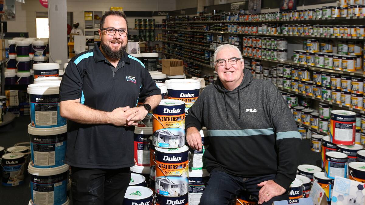 NEW HANDS: Owner of Inspiration Paint and Colour Geoff Gray with the retiring owner Errol Gibb. Picture: JAMES WILTSHIRE.