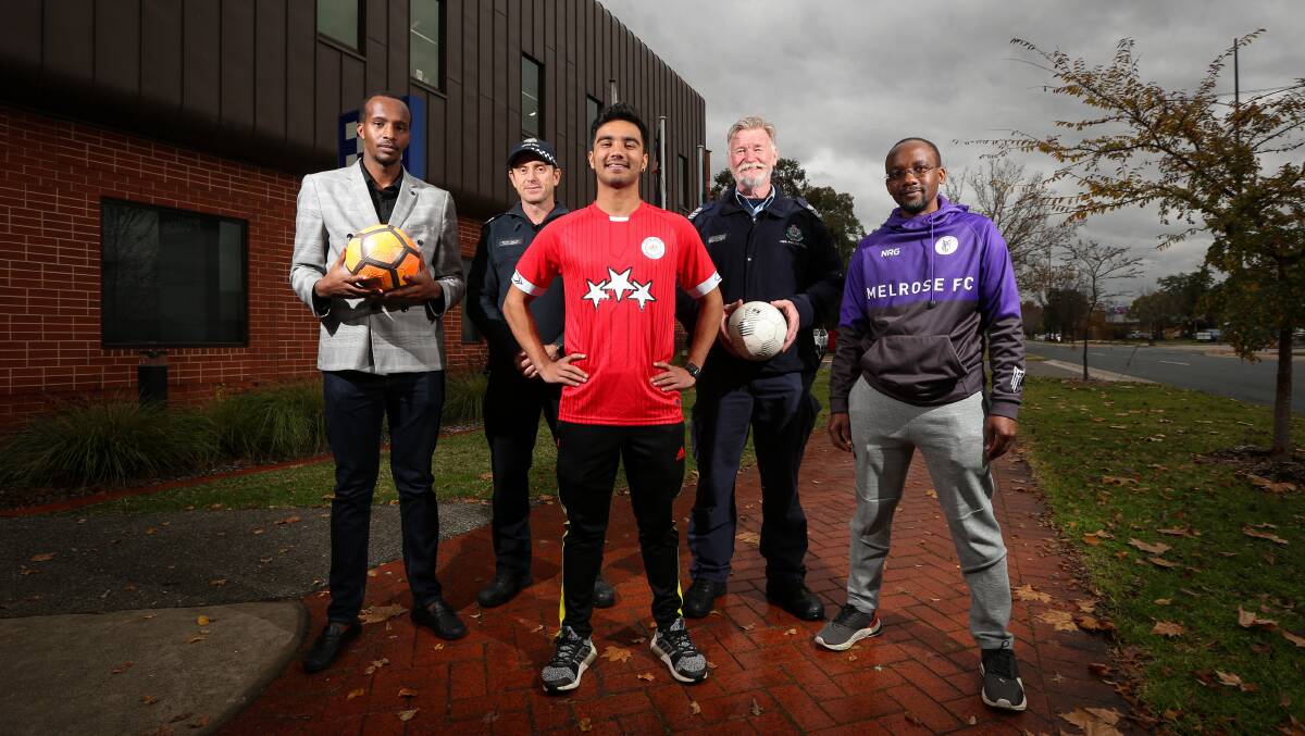 BUILDING BRIDGES: Albury and Wodonga police will play soccer with multicultural communities on Saturday. Patrick Sibomana, Senior Sergeant Shane Martin, Govinda Dahal, Senior Sergeant Les Nugent and Richard Ogetii. Picture: JAMES WILTSHIRE