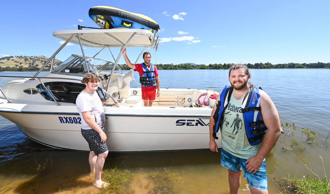 SKIING TIME: Scott Webb, Brandon Webb and Christen Webb were still keen to go water skiing after hearing about the blue green algal bloom in the Lake. Picture: MARK JESSER