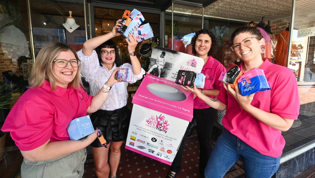PRODUCT DONATIONS: Samantha McFarlane, Zeinert & Co Clothing store manager Chris Burgess, Belinda Horn and Ashley Edwards urge community members to donate period products to those in need. Picture: MARK JESSER
