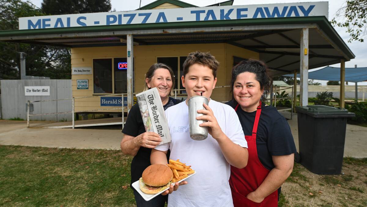 AT HOME: Urana Takeaway and Newsagency owners Sue Macgregor and Michelle Forrester, with 12-year-old Cash Forrester. The family moved to the town from Sydney last year. Picture: MARK JESSER