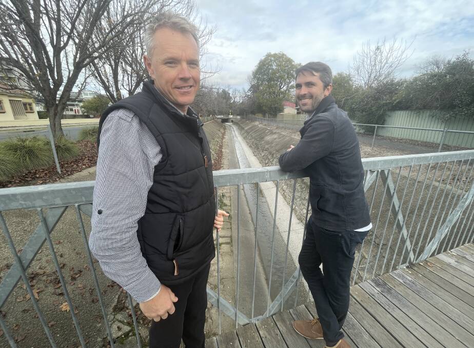 INVESTIGATING: Albury Council's David Costello and Alluvium Consulting's Ben Walker over the Bungambrawatha Creek at Gertrude Colquhoun Park. Picture: VICTORIA ELLIS