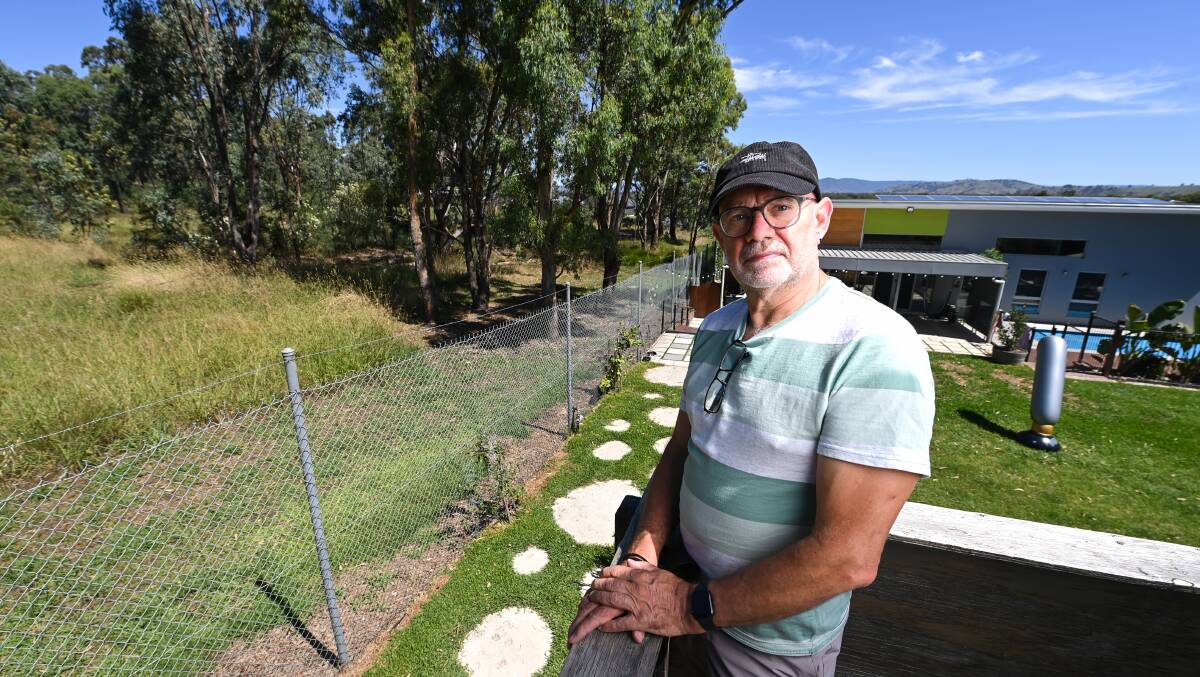 ALTERNATE VIEWS: Murray Park Estate Paddlesteamer Court resident and suicide prevention worker Chris Pidd says the floods will have a long lasting emotional impact of the community. Pictures: MARK JESSER